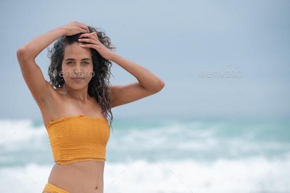 Portrait of woman with blurred background of ocean - Stock Photo - Images