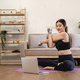 sport, fitness and healthy lifestyle concept - happy smiling young asian woman with laptop computer - PhotoDune Item for Sale