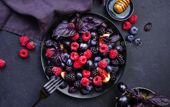 Summer blue and black berries fruit vegan salad: blueberries, blackberries, grapes
