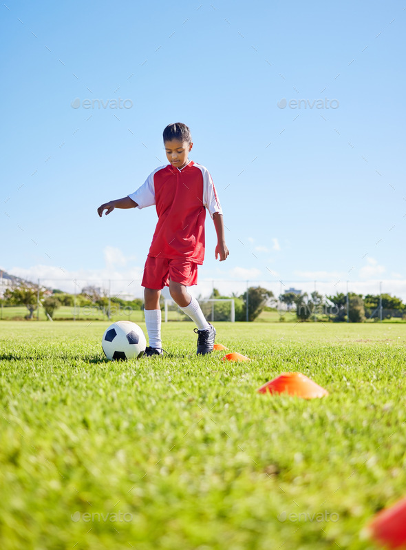 Football girl kid, grass and training for fitness, sports or balance with talent development, contr