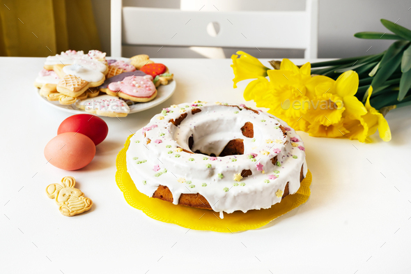 Easter cake, eggs and cookies on white table background - Stock Photo - Images