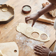 Cropped black woman baking homemade pastry and cutting cookie shapes - PhotoDune Item for Sale