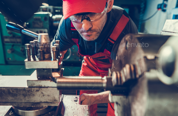 Lathe Machine Operator Processing Piece of Metal Element - Stock Photo - Images