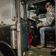 Caucasian Trucker Inside American Semi Truck Tractor - PhotoDune Item for Sale