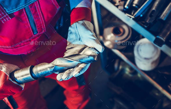 Metalworking Technician with Large Drill Bit in His Hands - Stock Photo - Images
