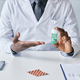 Closeup black doctor holding bottle of pills - PhotoDune Item for Sale