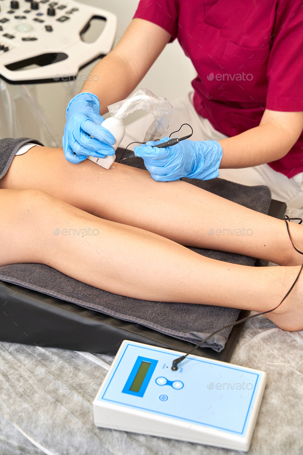 Therapist performing a percutaneous electrolysis procedure with an