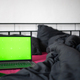 Laptop with green chroma key screen and smartphone on bed with viva magenta bed sheet. Home office - PhotoDune Item for Sale