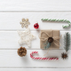 A Christmas gift wrapped in kraft paper with various organic decorations. Zero waste. - PhotoDune Item for Sale