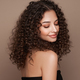 Beautiful smiling woman with afro curls - PhotoDune Item for Sale