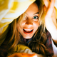 Portrait of cheerful attractive caucasian woman lying under the blanket at home and having fun - PhotoDune Item for Sale