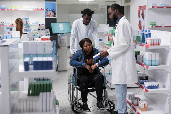 African american woman with disability shopping in drugstore - Stock Photo - Images