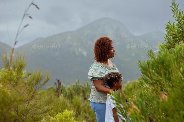 Mum and soon seen looking at plants - Stock Photo - Images