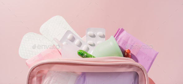 Pink bag with medicines and pads during menstruation - Stock Photo - Images