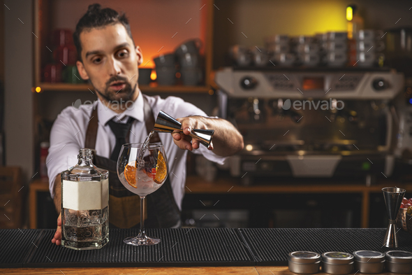 Bartender pouring drink - Stock Photo - Images