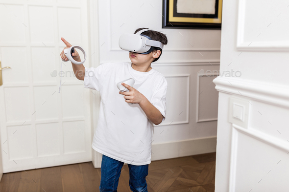 Young boy playing with virtual reality at home