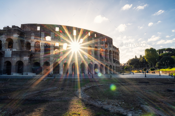 Morning view with sun beams of the Colosseum - Stock Photo - Images