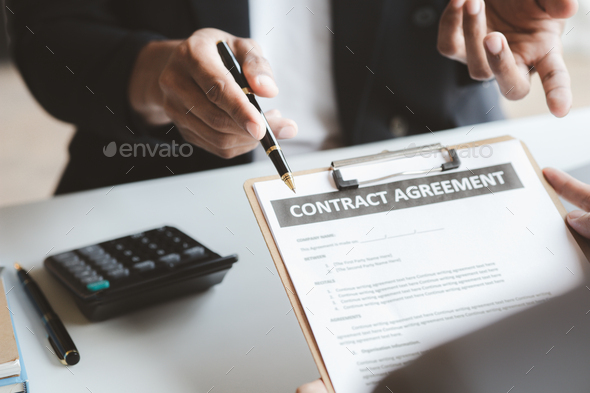 Rental company employee is calculating the cost for the customer to agree to sign a rental contract