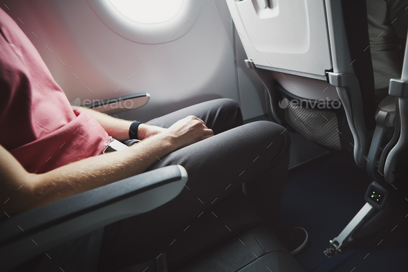 Man resting during flight - Stock Photo - Images