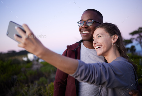Romantic Young Couple taking a photo with mobile phone. - a Royalty Free  Stock Photo from Photocase