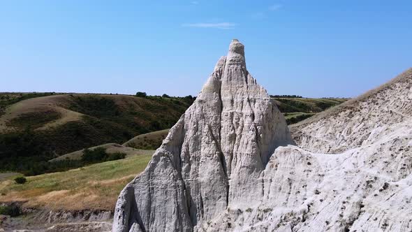 A cone shaped hill. High limestone pillar, chalk mountain