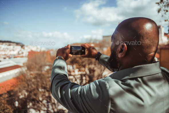 Black guy shooting city attractions - Stock Photo - Images