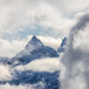 Mountains covered in Snow and Clouds during Winter Season. - PhotoDune Item for Sale