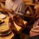 Close up of Middle Eastern woman praying with husband at dining table. - PhotoDune Item for Sale