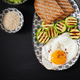 Breakfast. Toast with avocado guacamole, grilled zucchini and fried egg.  - PhotoDune Item for Sale