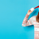 Winter and Christmas Eve concept. Cute teenage girl wearing santa hat and sweater, celebrating xmas - PhotoDune Item for Sale