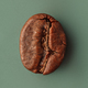Coffee bean macro photography on green background - PhotoDune Item for Sale
