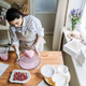 Female baker make Perfect custom pink heart shape cake in kitchen Bakery. Online Cake Store. custom - PhotoDune Item for Sale