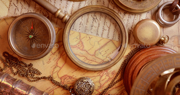 Vintage style travel and adventure. Vintage old compass and other vintage items on the table. - Stock Photo - Images
