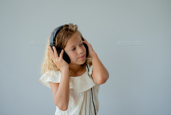 Music teenager girl dancing against background - Stock Photo - Images