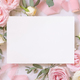 Blank card between pink roses and pink silk ribbons on marble top view, wedding mockup - PhotoDune Item for Sale
