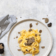 Scrambled eggs with fresh black truffles from Italy served in a plate top view, gourmet breakfast - PhotoDune Item for Sale