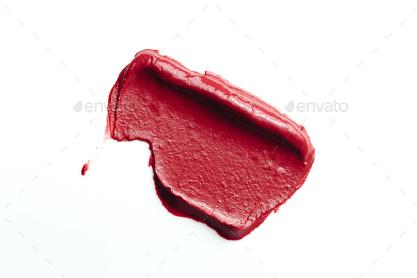 Red lipstick sample smudged isolated on white - Stock Photo - Images