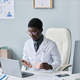 Young black doctor in online consultation - PhotoDune Item for Sale