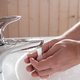 Man washes hands under a stream of clean running water, over the sink, in the bathroom - PhotoDune Item for Sale