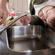 Man looks in bewilderment at the faucet from which water has stopped flowing, above the sink - PhotoDune Item for Sale