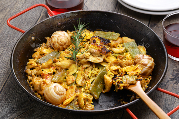 Paella Valenciana (Spanish traditional rice dish) - Stock Photo - Images