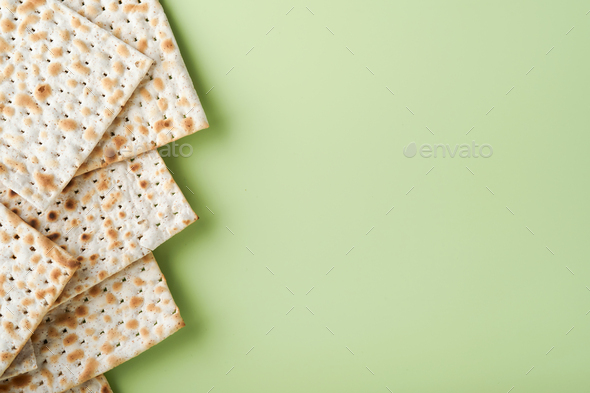 Matzah, red kosher and walnut. Passover celebration concept. Traditional ritual Jewish bread on ligh - Stock Photo - Images