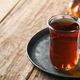 Turkish black tea. Glass cup of turkish black tea and crispy Turkish traditional bagel on old rustic - PhotoDune Item for Sale