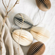 Easter egg-shaped decorations and branches on linen tablecloth. - PhotoDune Item for Sale