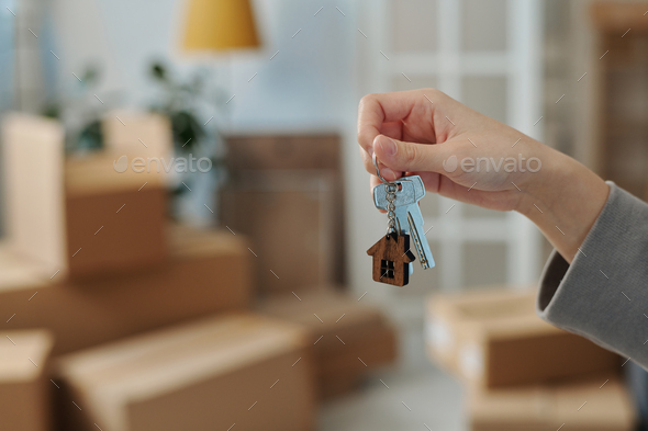Woman holding keys from new house - Stock Photo - Images