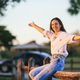 Portrait of happy young woman outdoor in the park at sunset - PhotoDune Item for Sale