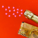 Champagne bottle with confetti and wrapped gift. Flat lay - top view. Valentines day concept. - PhotoDune Item for Sale