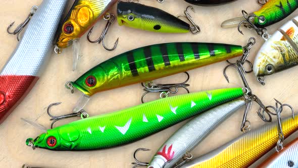 Fishing wobblers on a wood texture background alt