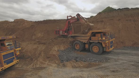Aerial Shoot Excavator Bucket Digs Coal alt