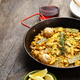 Spanish Valencian traditional paella; rabbit, chicken, garrofon beans, snails, Moroccan green beans, - PhotoDune Item for Sale